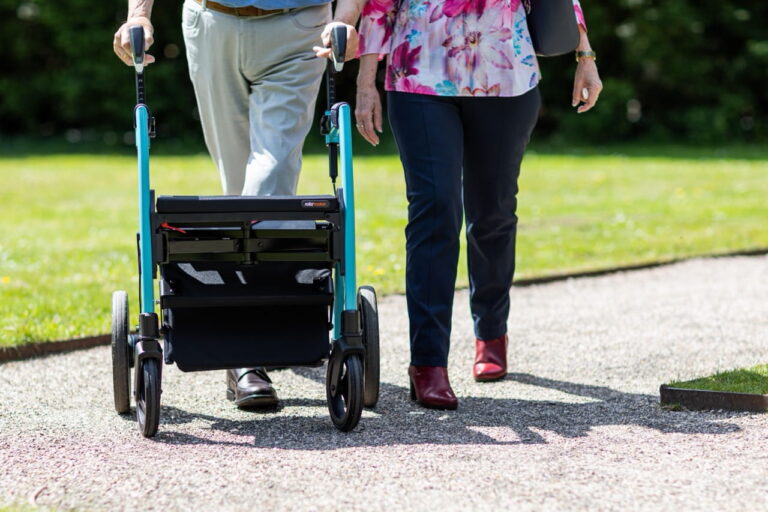 people walking with walker assistance