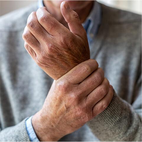 man holding wrist