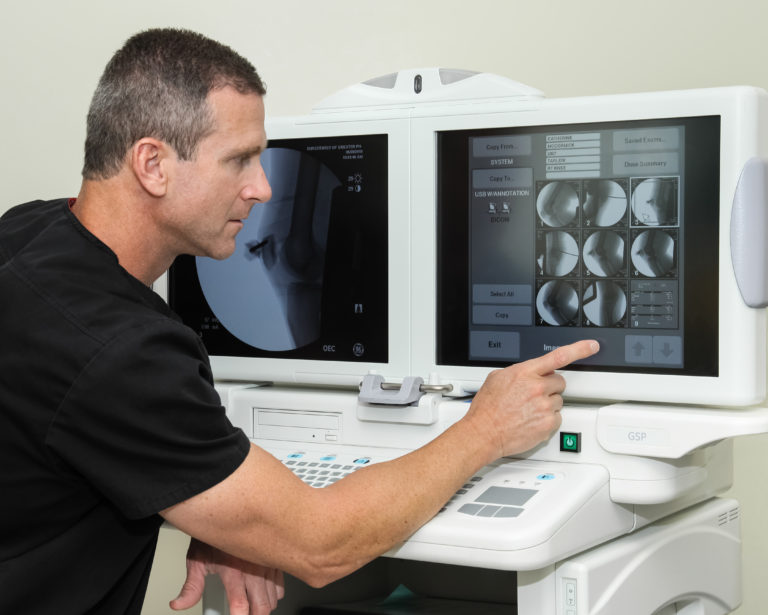 Dr Martin examining scans