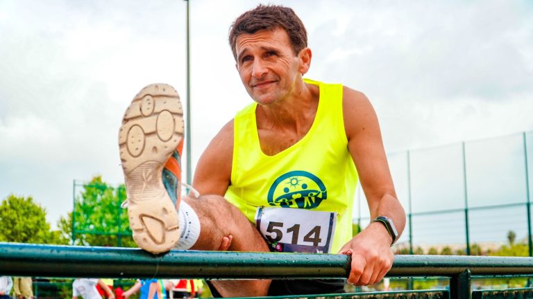 Runner stretching his legs before a race