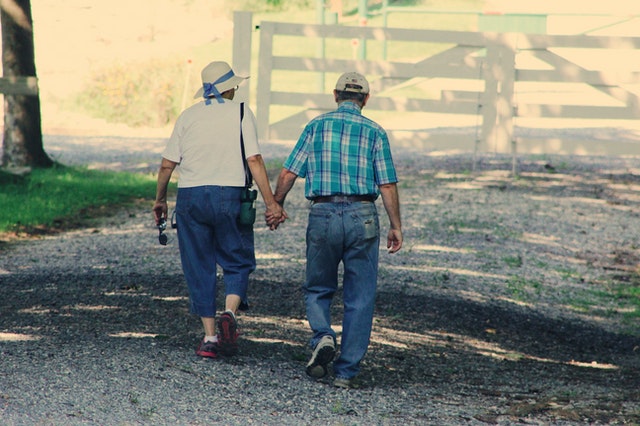 Elderly couple going for a walk