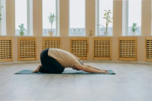 older man doing yoga