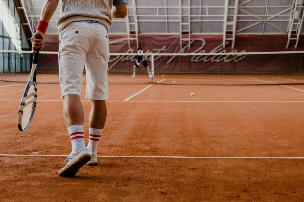 close up of a persons knees while playing tennis