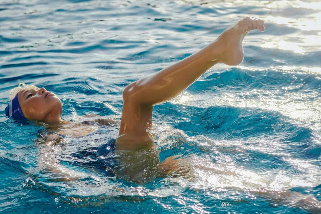 woman doing aquatic therapy in a pool