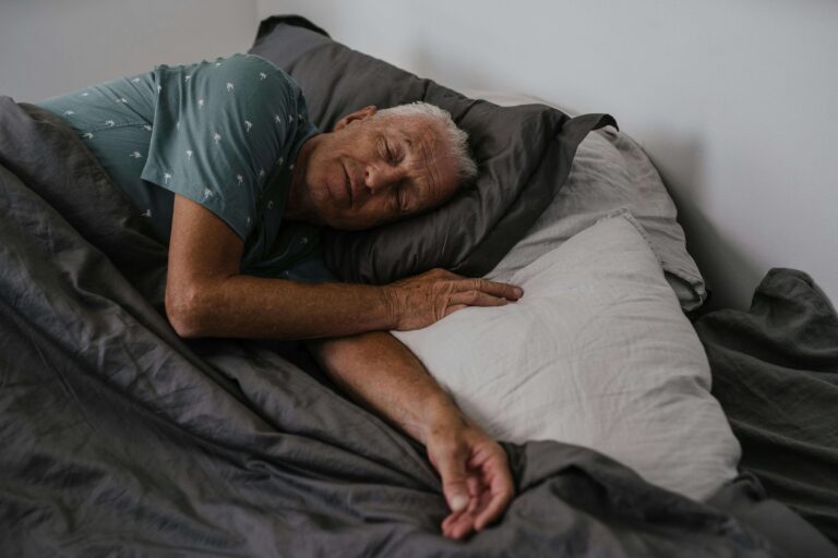 older man sleeping comfortably on his side