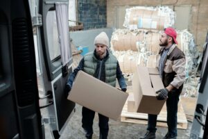 photo of two men moving