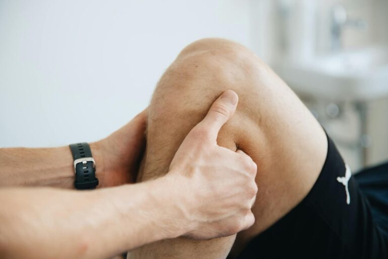 Physical therapist working on a patient's knee