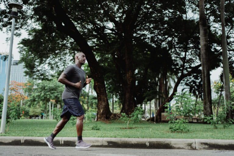 man jogging through a park