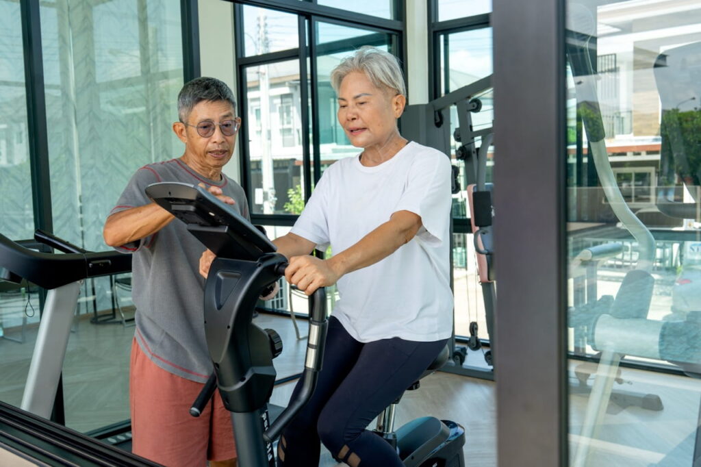 Older woman cycling on stationary bike