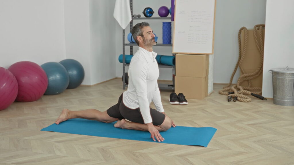 Man doing yoga on a mat