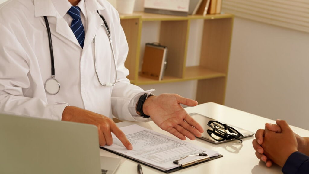 Physician speaking with a patient